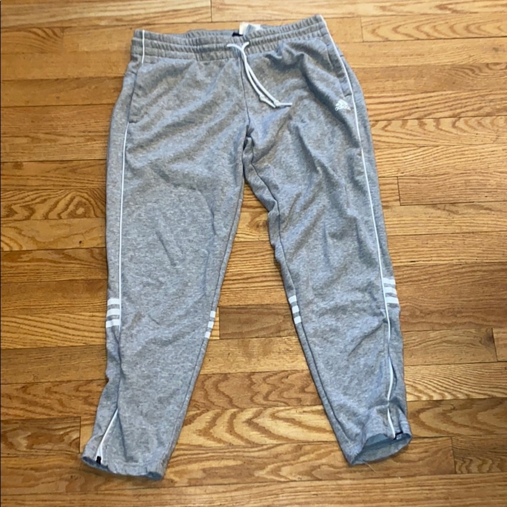 Grey Adidas sweat pants.